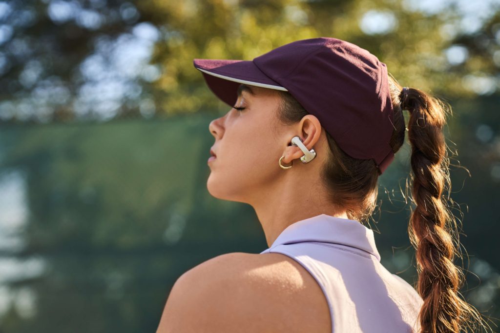 Female person wearing Shokz OpenDots ONE